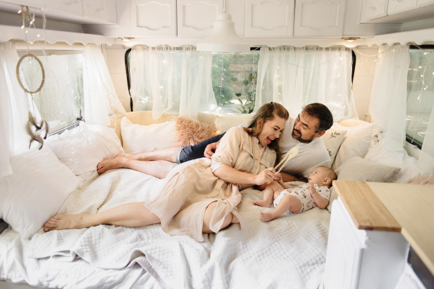 family-with-baby-bed-trailer-morning-newborn-child-traveling-camper-with-parents-view-from-van-inside_211214-85